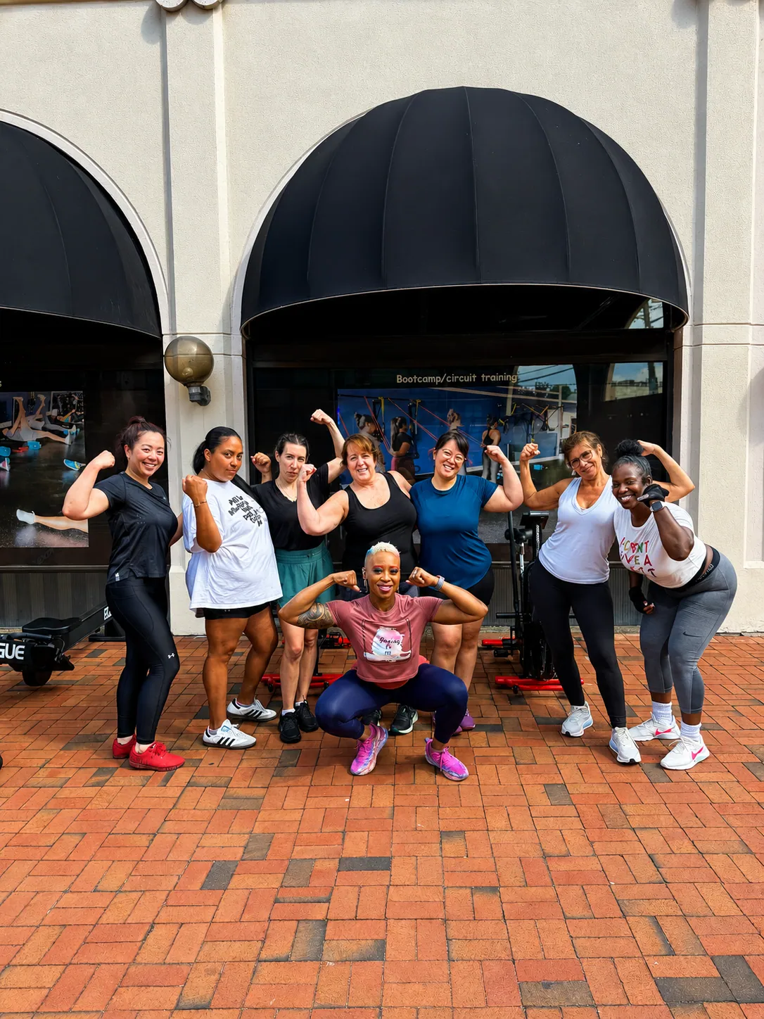 Coach Roxy training with a small group outside the StretchPlusFlex studio