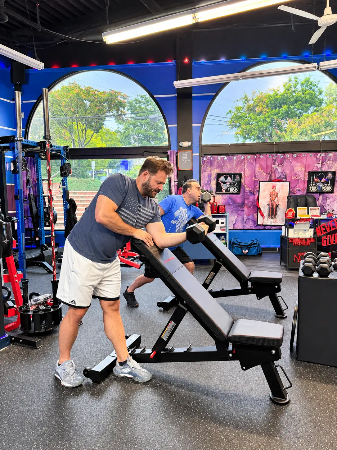 Members doing ring rows during a Stretch & Flex circuit class at StretchPlusFlex